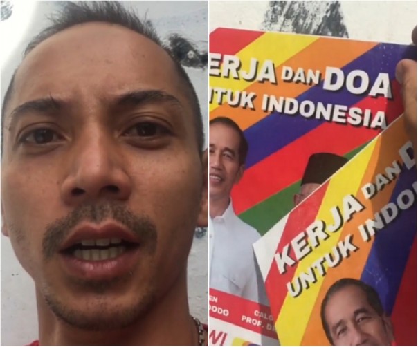 Fauzi Baadilla saat mencopot poster Jokowi-Ma'ruf yang tertempel di tembok rumahnya