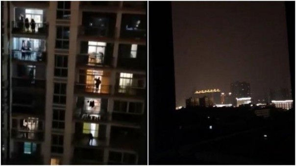 Warga Kota Wuhan berdiri di teras apartemen dan saling bersahut-sahutan memberikan dukungan satu dengan yang lain. Kejadian ini tengah viral di media sosial. Foto: int 