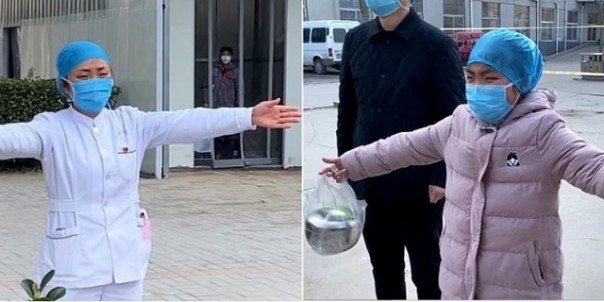 Suster di salah satu rumah sakit di China hanya bisa memeluk anaknya dari jauh, karena sedang menangani pasien virus Corona. Kisah ini tengah viral di media sosial. Foto: int 