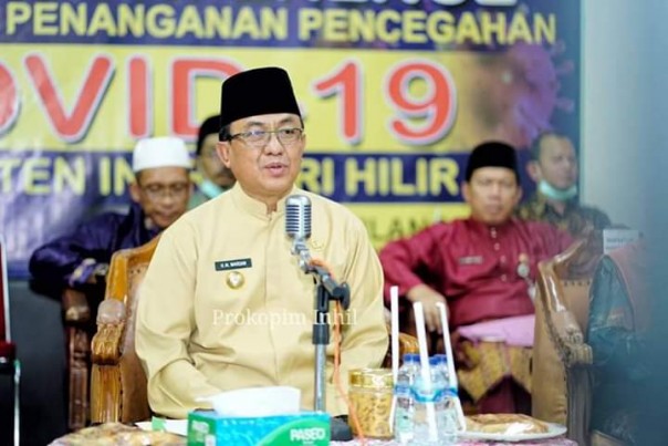 Bupati Kabupaten Indragiri Hilir (Inhil), HM Wardan mengajak seluruh elemen masyarakat bersinergi dalam menghadapi wabah Covid-19 di Kabupaten Inhil (foto/ist)