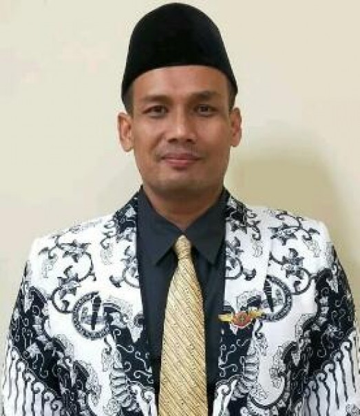ketua PGRI Riau Dr Muhammad Syafi'i (foto/Wira)