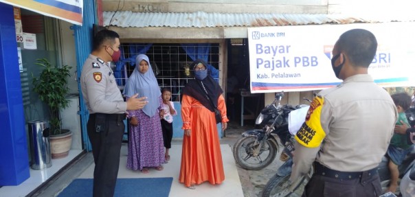 Antisipasi Penyebaran Covid-19, Personil Polisi Sektor Langgam Rutin Laksanakan Patroli C3 dan Sosialisasi Antisipasi Covid-19.