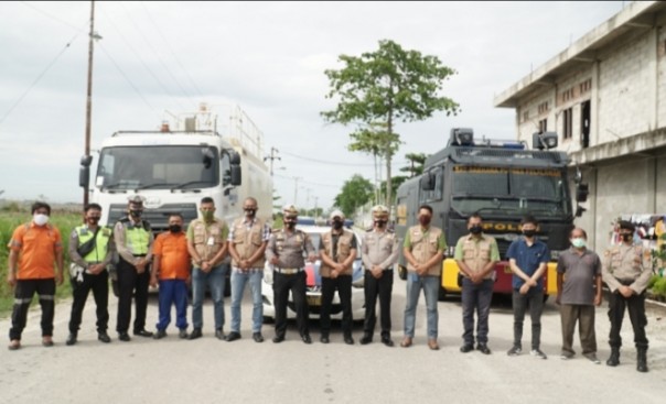 Pelalawan dan RAPP APR Semprotkan Disinfektan di Kota 