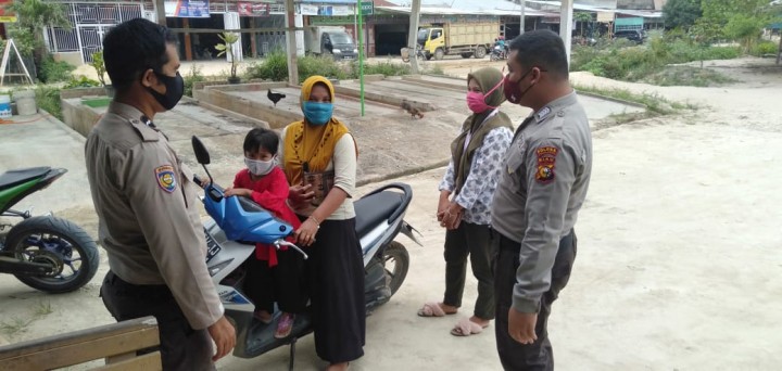 Bhabinkamtibmas Langgam Gelar Patroli dan Sosialisasi Covid-19