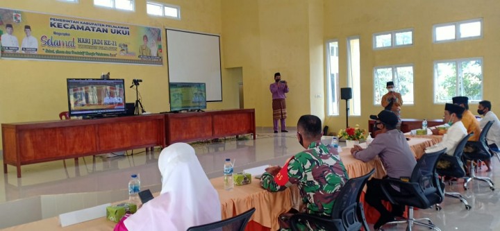 Kapolsek Ukui Bersama Forkopimca Laksanakan Upacara Virtual Peringati Hari Jadi Ke - 21 Kabupaten Pelalawan