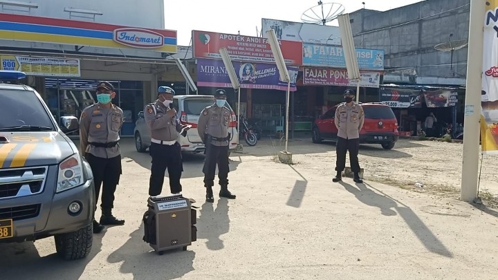 Polsek Pangkalan Lesung Himbau Warga Agar Berpartisipasi Dalam Pilkada Kabupaten Pelalawan